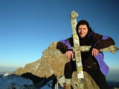 07B Jerome Ryan Hugs The Cross On The Point Lenana 4985m Summit With Mount Kenya Behind Just After Sunrise On The Mount Kenya Trek October 2000